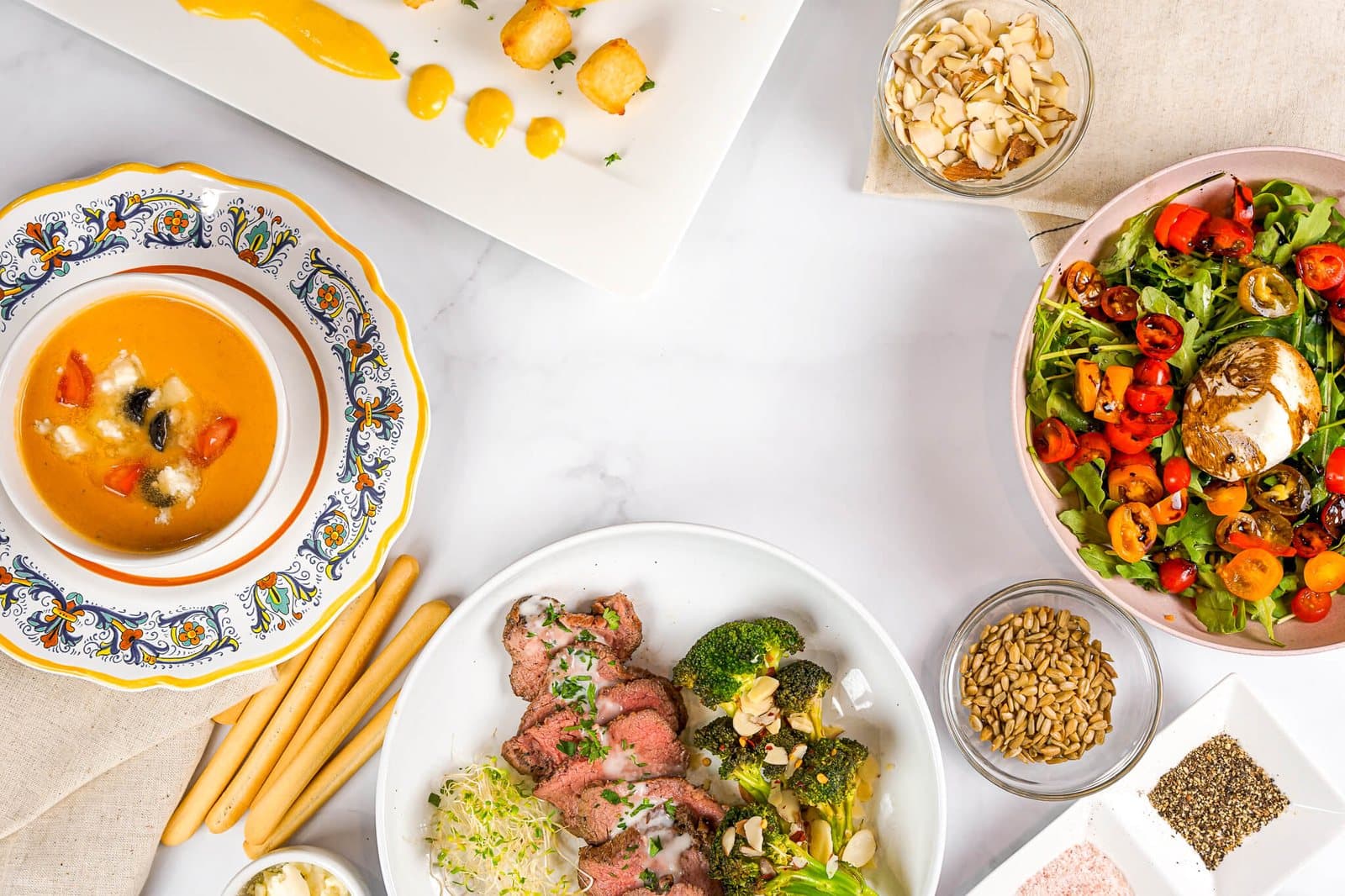 A private chef plating a course in a client's home kitchen