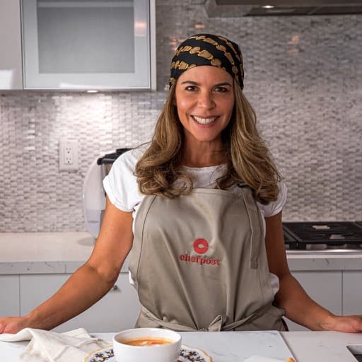 Chef Gina, a Chefpost private chef in Miami, smiling in a home kitchen