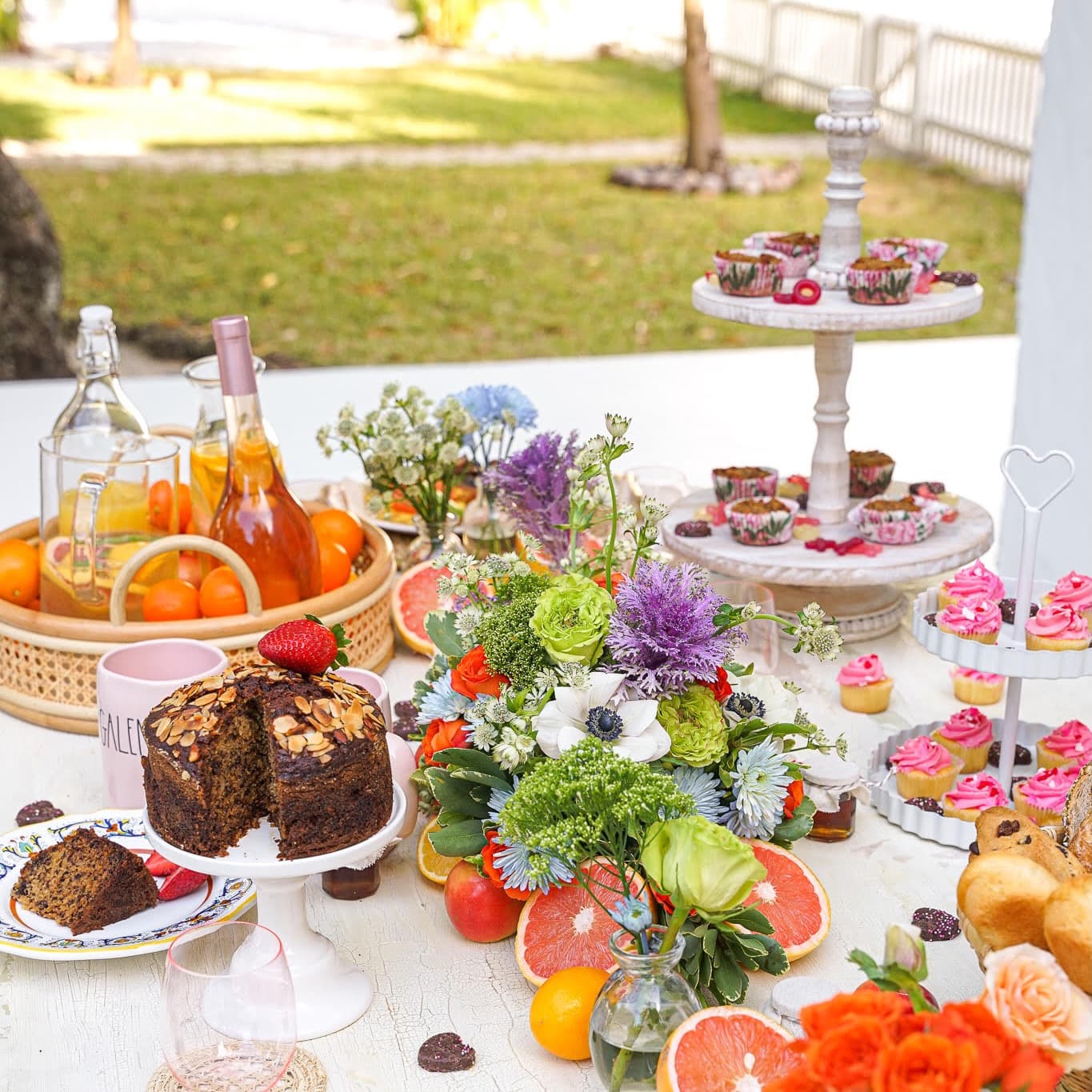 A weekend brunch spread set outdoors by a private chef in a Coconut Grove garden