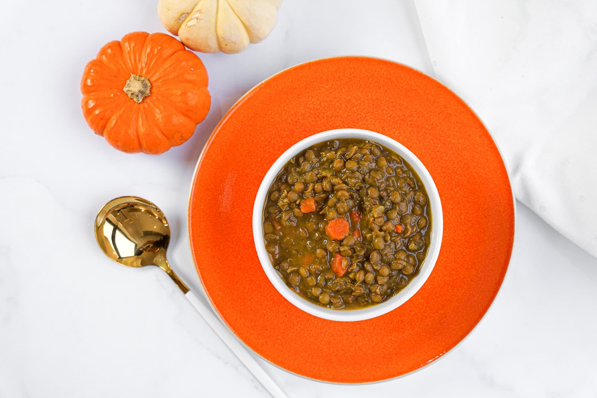 A bowl of lentil soup prepared by a postpartum chef