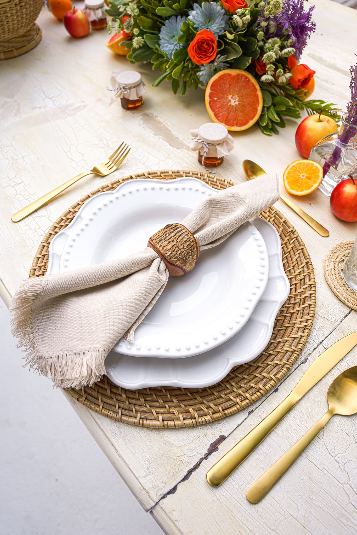 A bright spring table setting with citrus and flowers set by a private chef in St. Petersburg