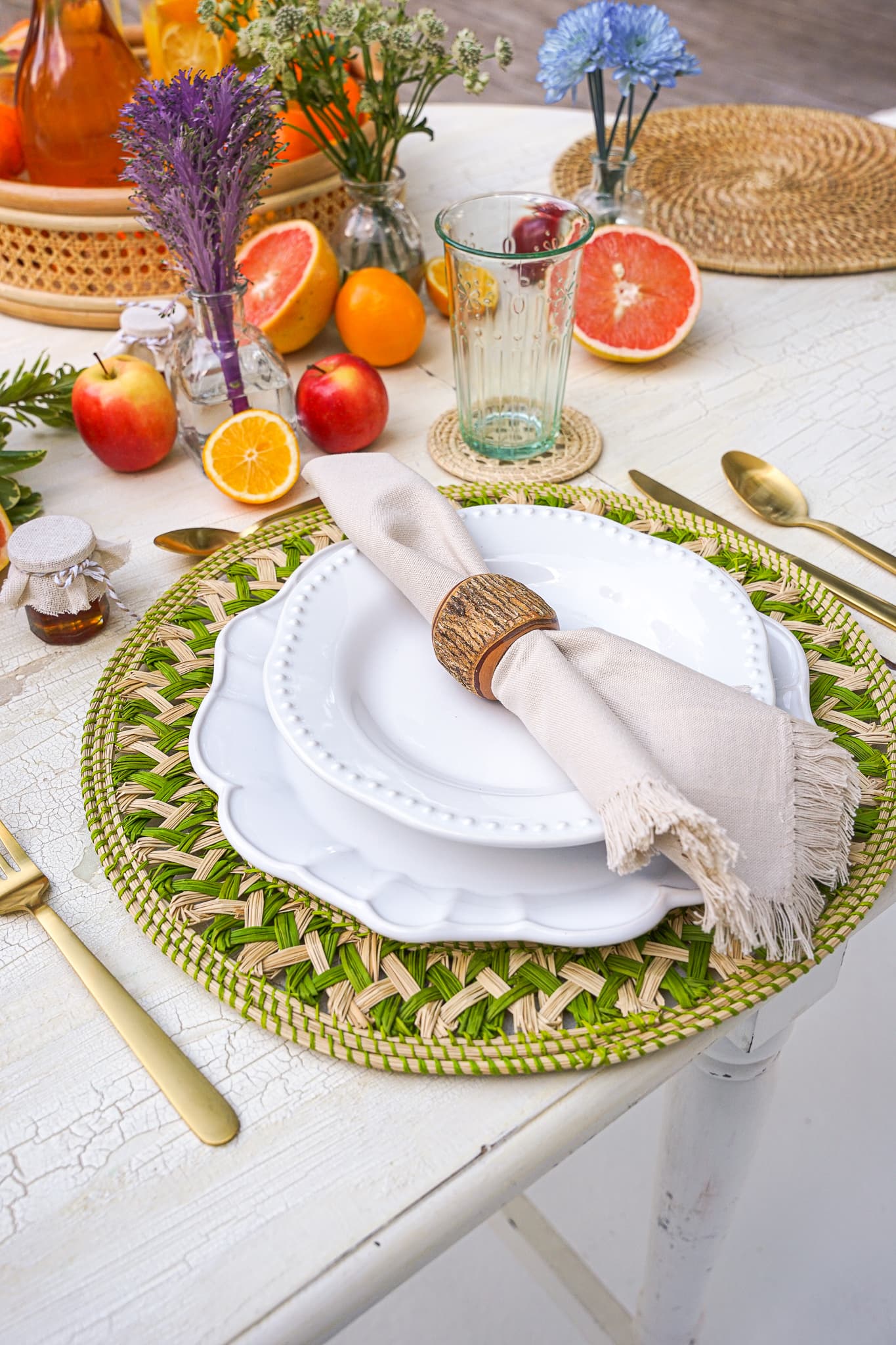 A green-and-citrus spring place setting for a private chef dinner on Miami Beach