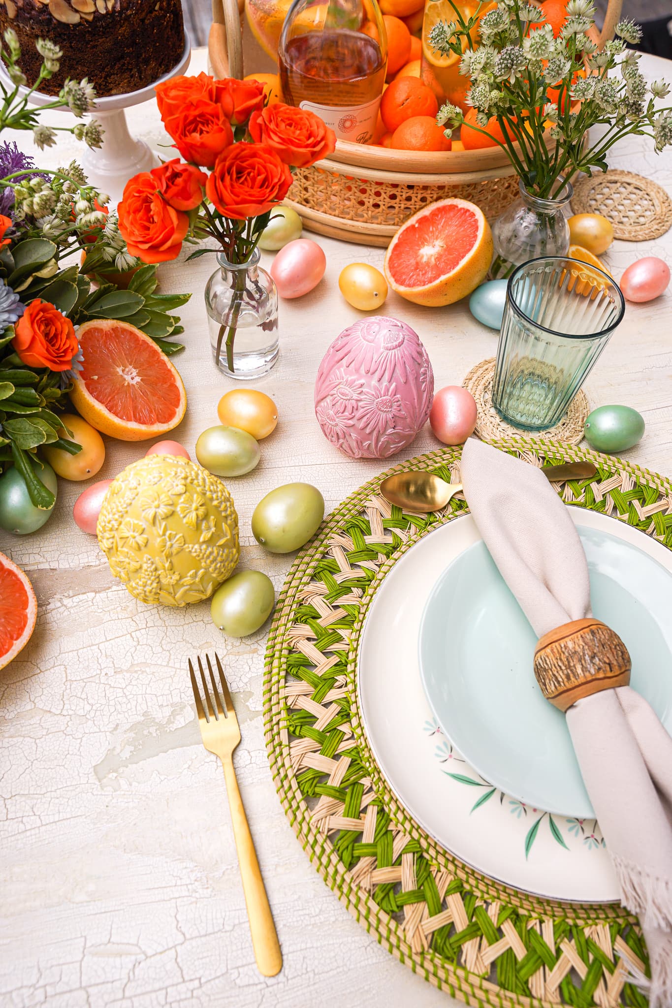 A bright pastel spring table with flowers and fruit set by a private chef in Wynwood