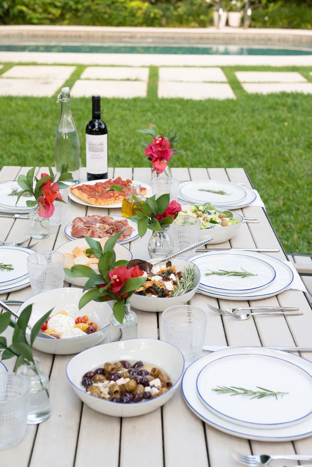 An outdoor table laid with seasonal dishes for a farm-to-table dinner in West Palm Beach