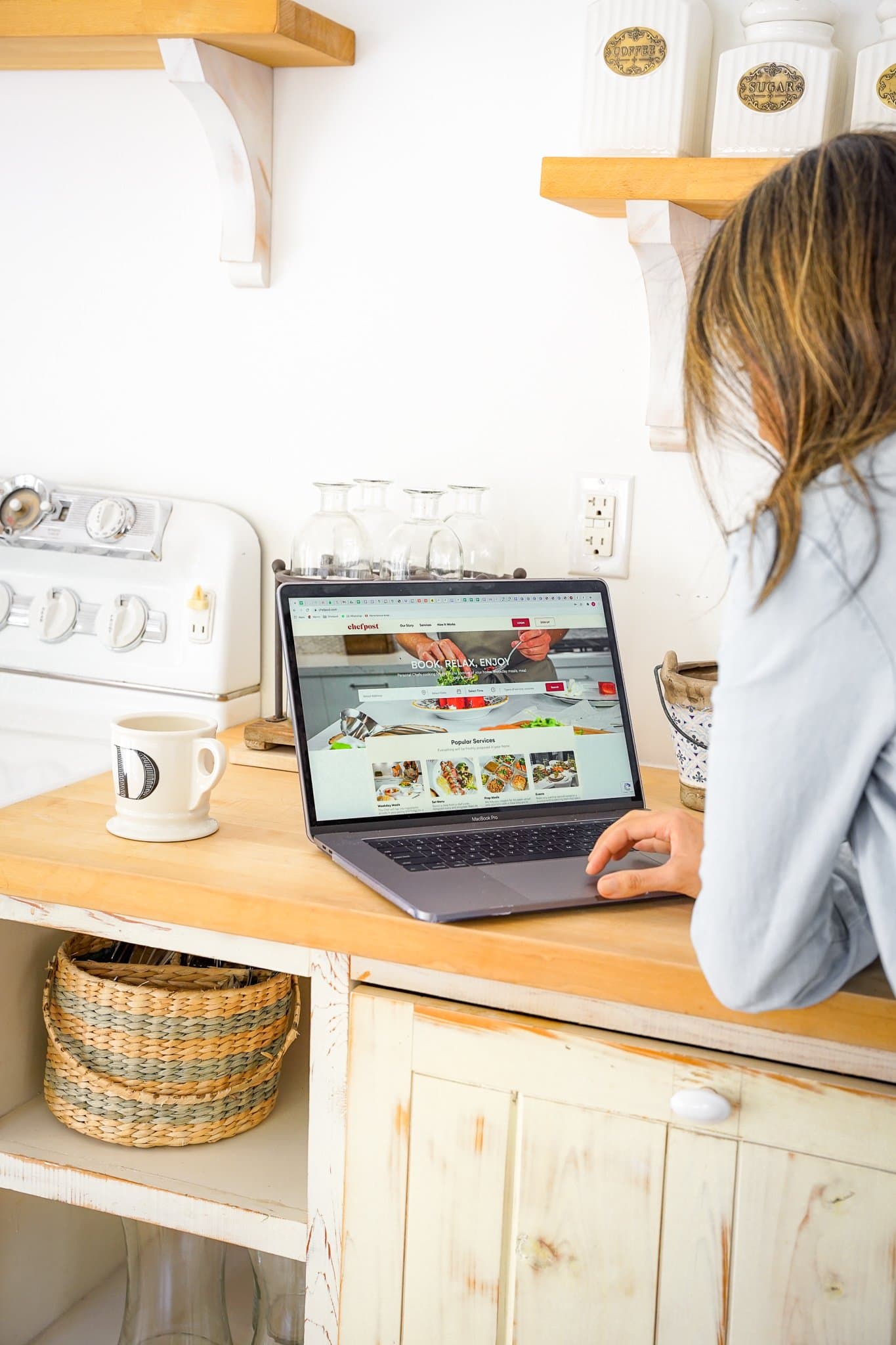 A client browsing Chefpost chef profiles and menus from her kitchen