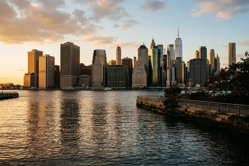 The Manhattan skyline at golden hour seen across the East River