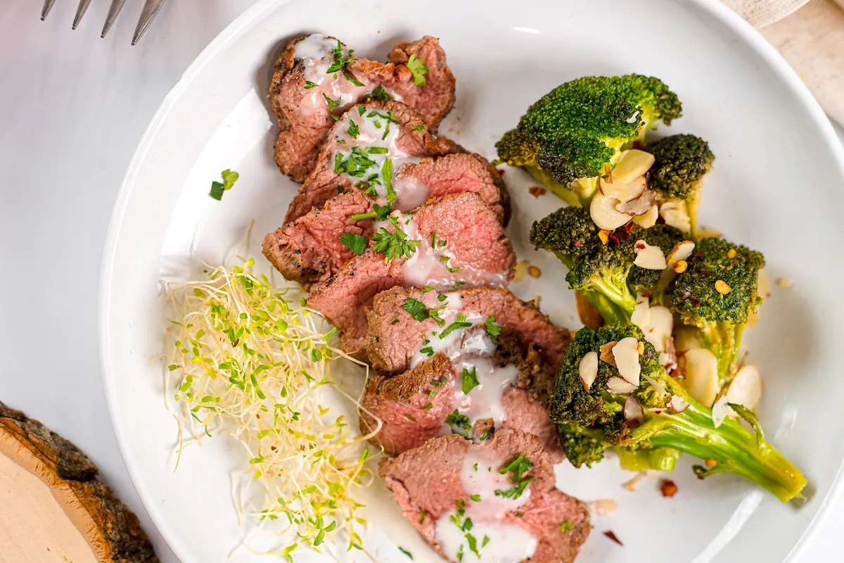 A plated beef main course served at an executive dinner in Short Hills