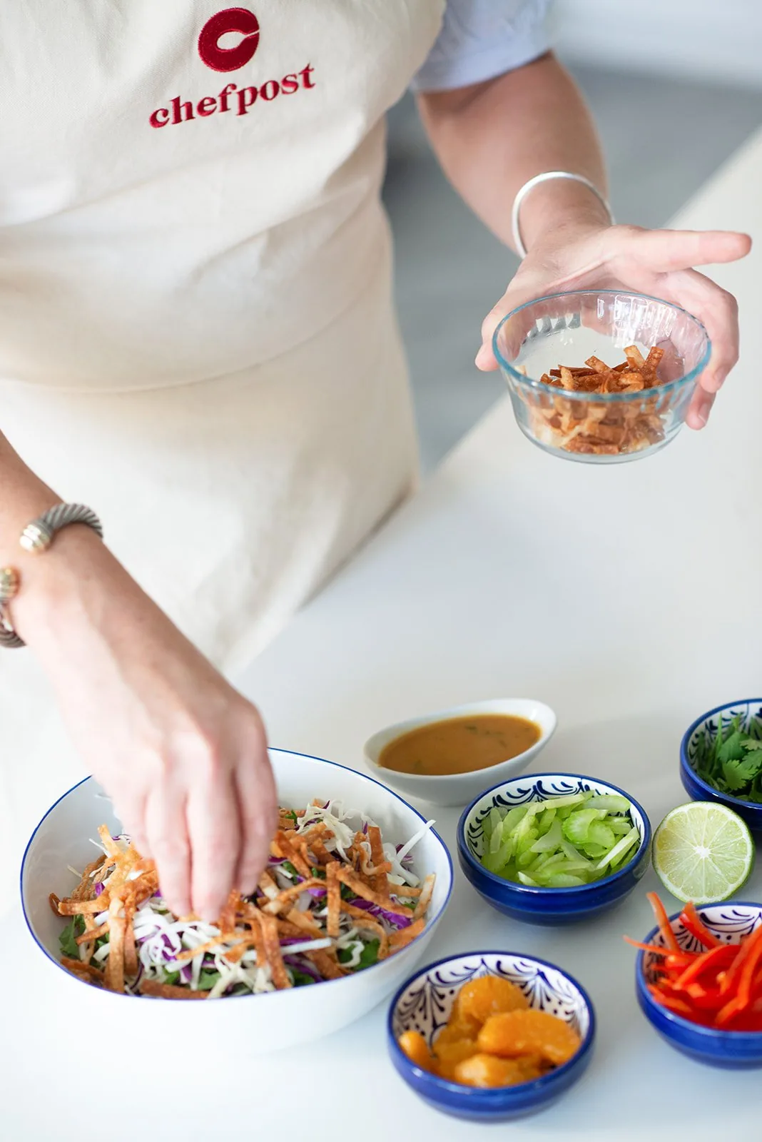 A Chefpost chef assembling a fresh, special-diet bowl in a home kitchen